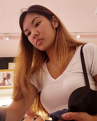 Asian girl in the store, frontal upskirt