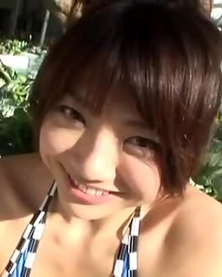 Sunbathing near the pool Hitomi Aizawa gets the way too horny